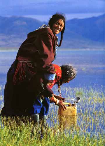 
Mother And Daughter Pilgrims Ladle Holy Water From Lake Manasarovar - Himalaya The Secret Of The Golden Tara By Dieter Glogowski book

